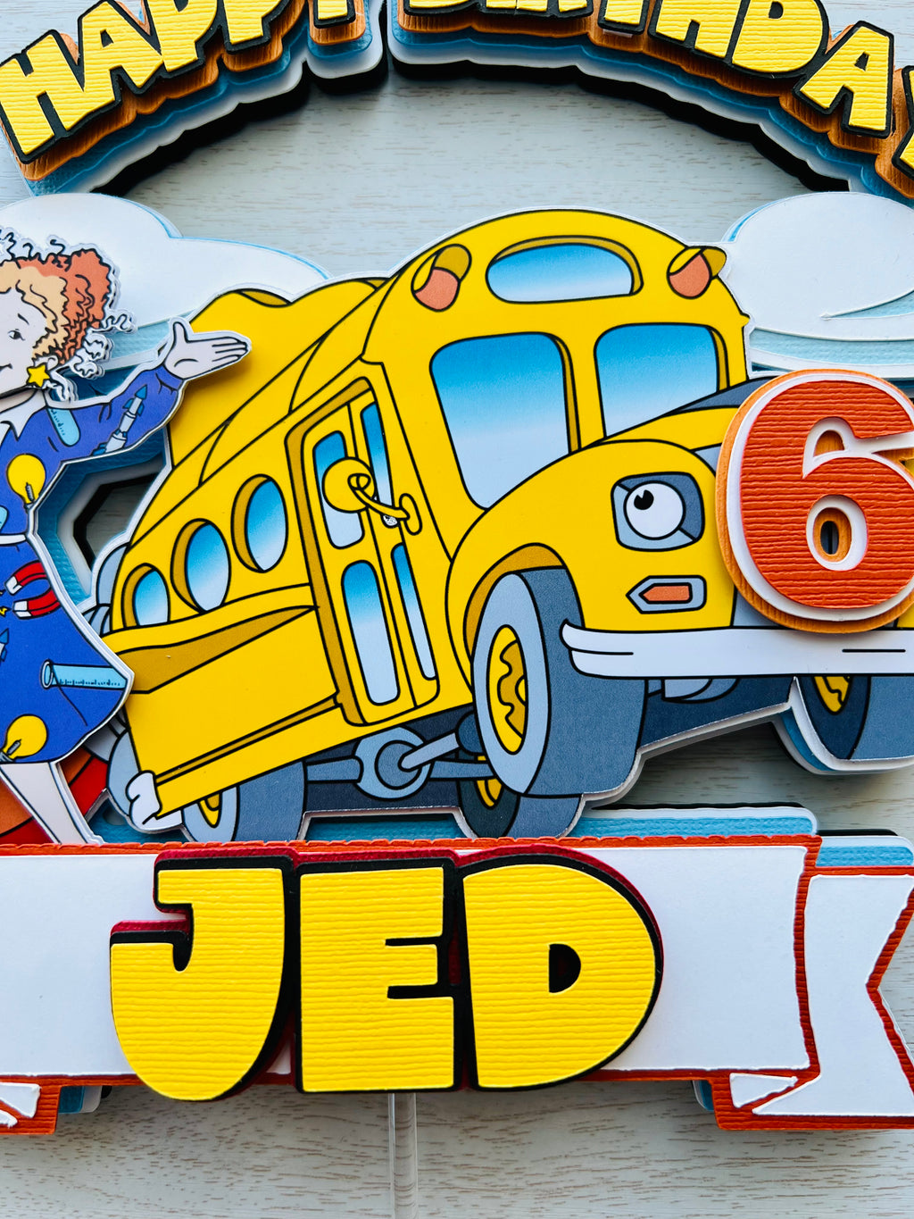 the magic school bus cake topper